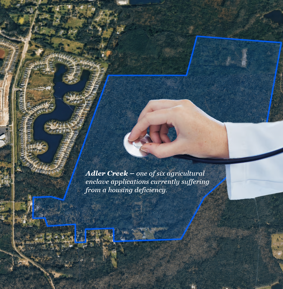 Satirical aerial image of the 610-acre Adler Creek property outlined in blue, with a doctor placing a stethoscope on the undeveloped land to diagnose a fictional “housing deficiency.”