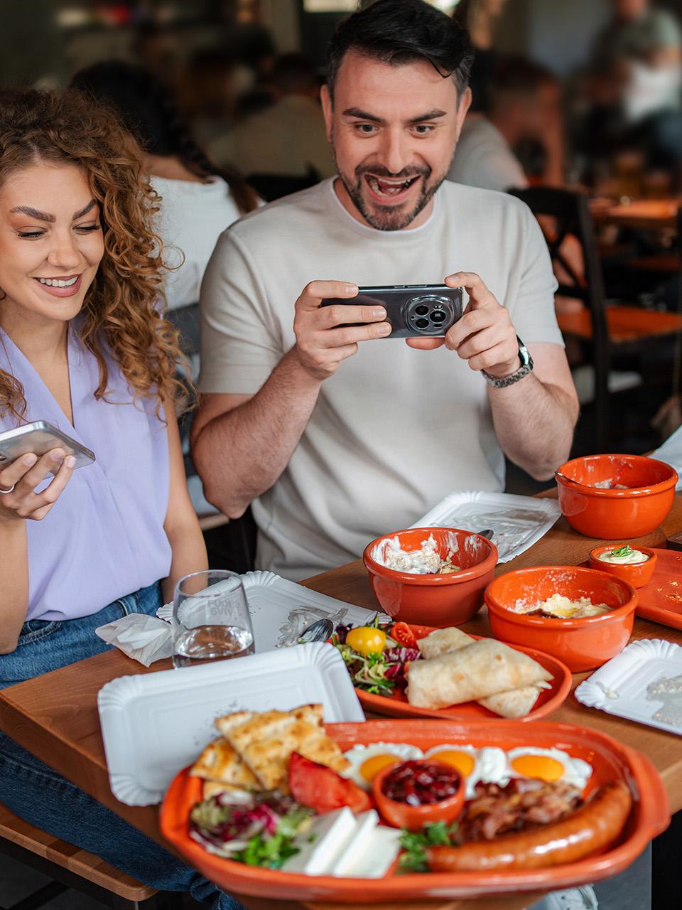 Food influencer filming a meal inside a quiet local St. Johns County restaurant.